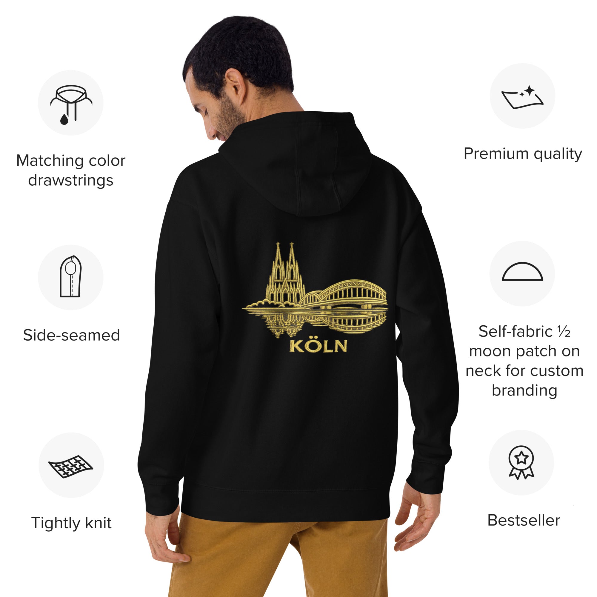 Black hoodie with gold 'Köln' design on the back, displayed on a man, with product features listed.