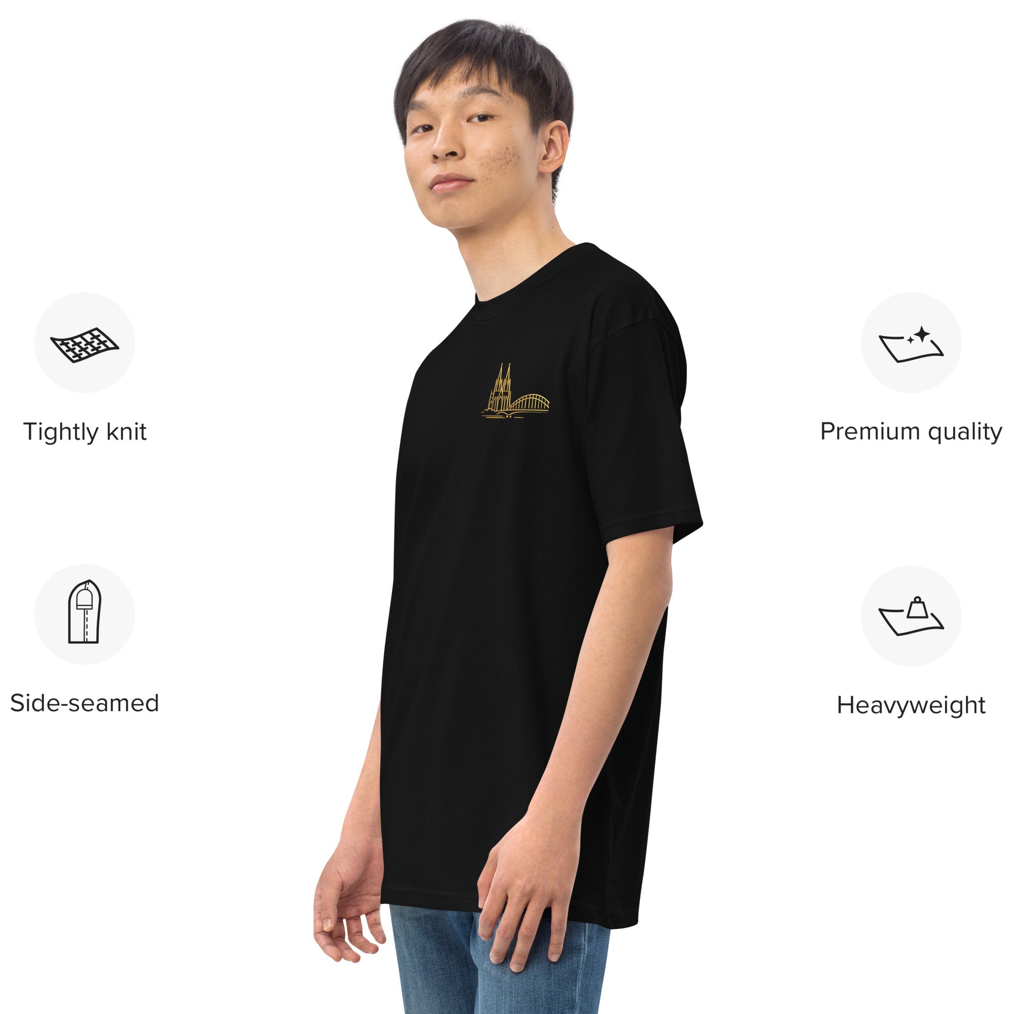 Person wearing a black t-shirt with a gold logo on a white background