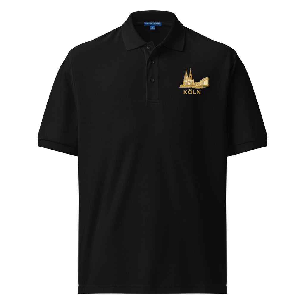 Black polo shirt with gold emblem and 'Köln' text on a white background