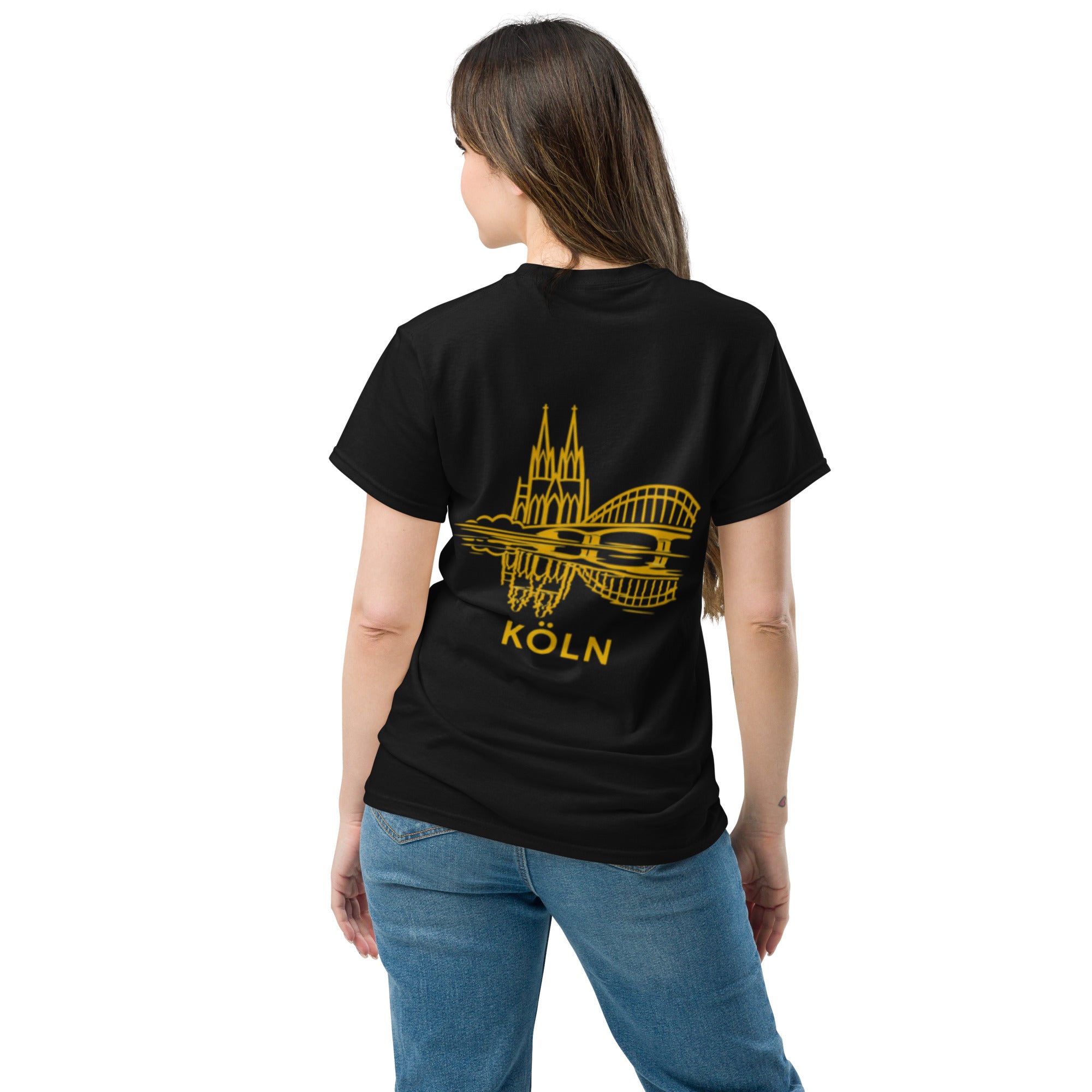 Person wearing a black t-shirt with yellow design and 'Köln' text on the back, standing against a white background