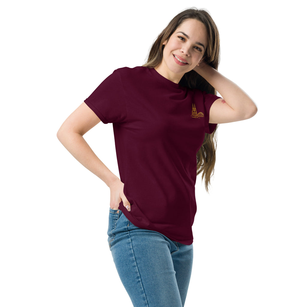 Woman wearing a maroon t-shirt with a logo on a white background