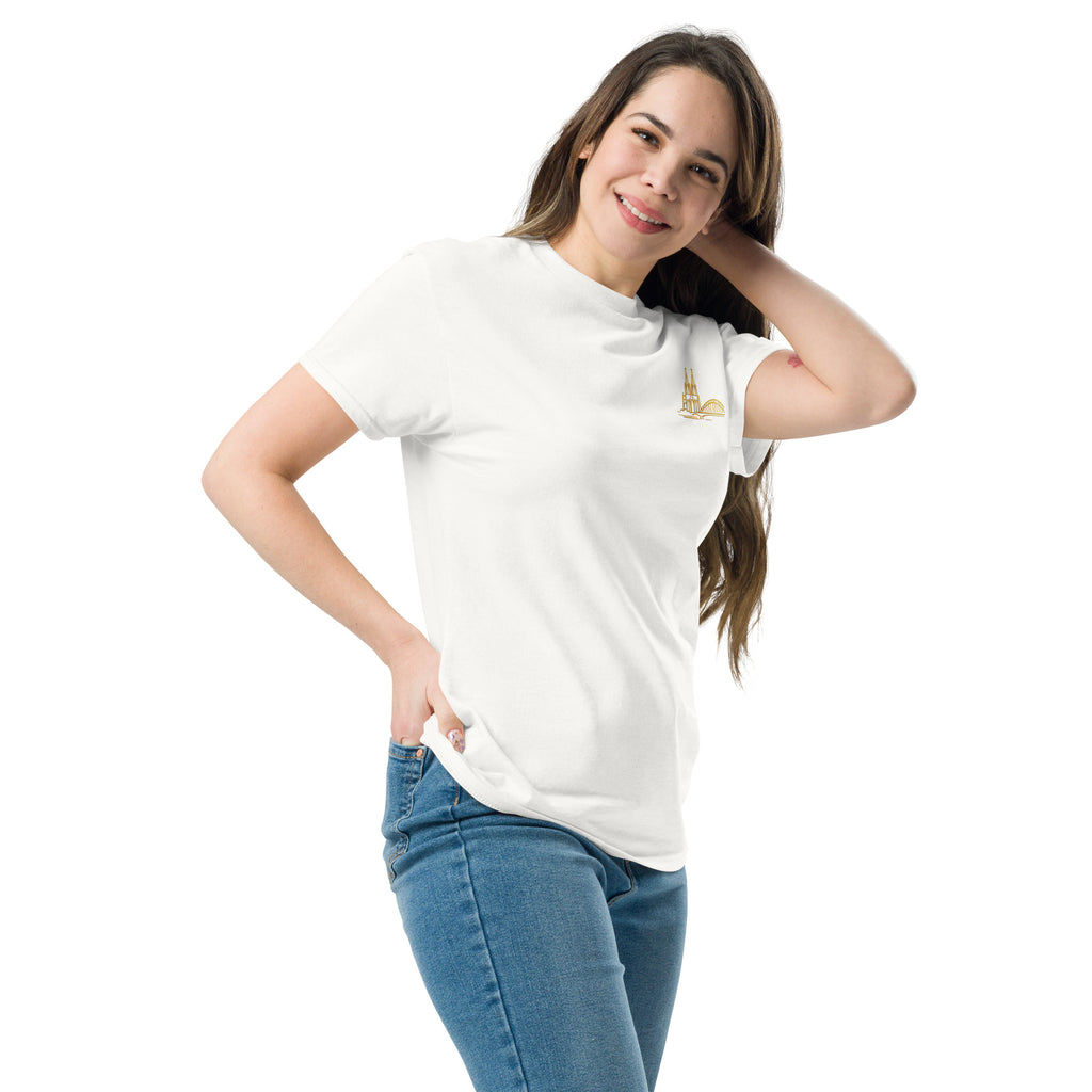 Woman wearing a white t-shirt with a logo and blue jeans on a white background