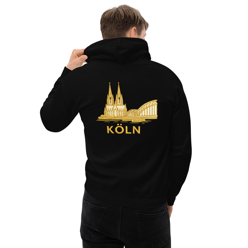 Person wearing a black hoodie with gold 'Köln' design on the back