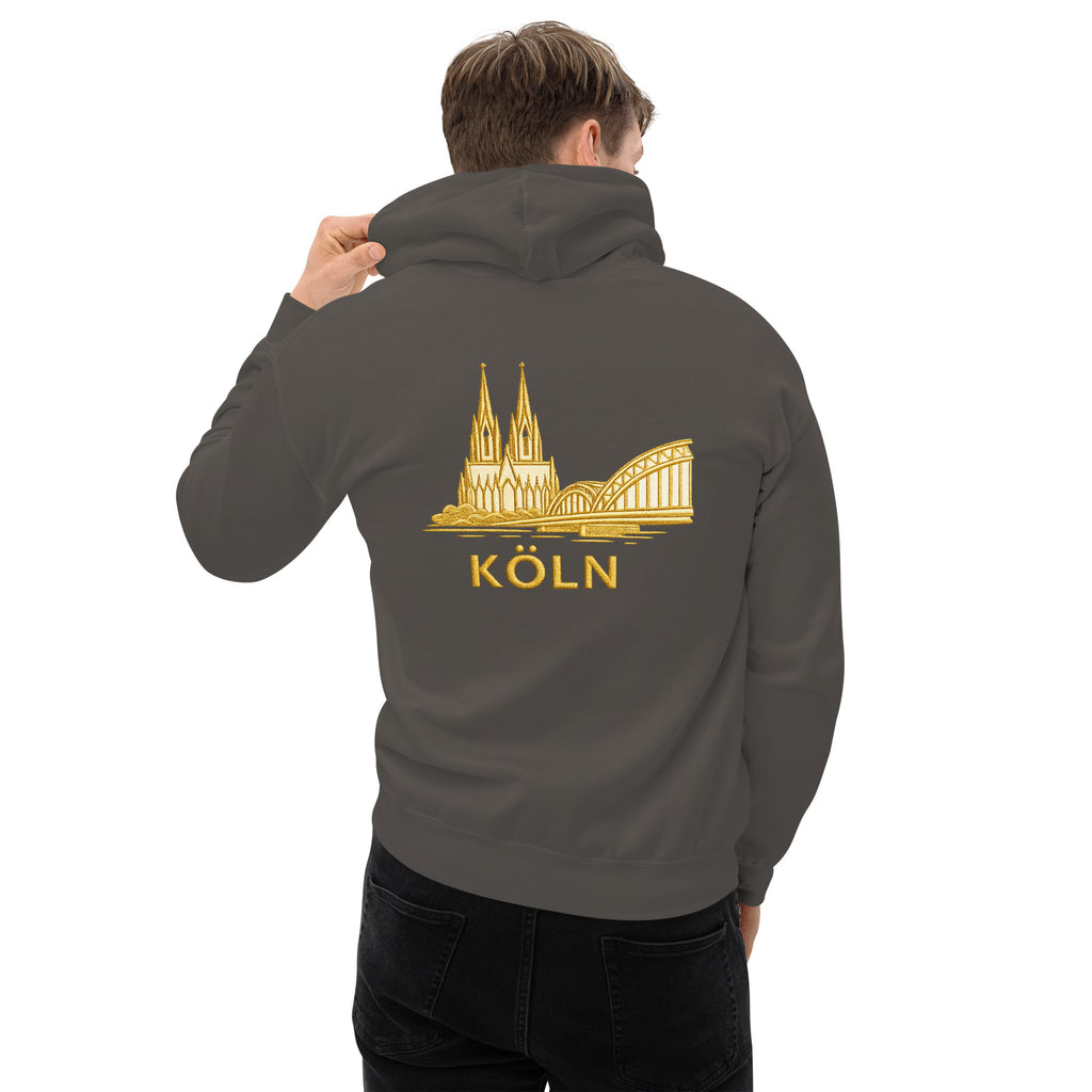 Person wearing a gray hoodie with a gold 'Köln' design on the back
