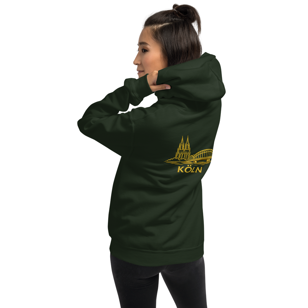 Person wearing a forest green Köln hoodie with a yellow logo and text on a white background