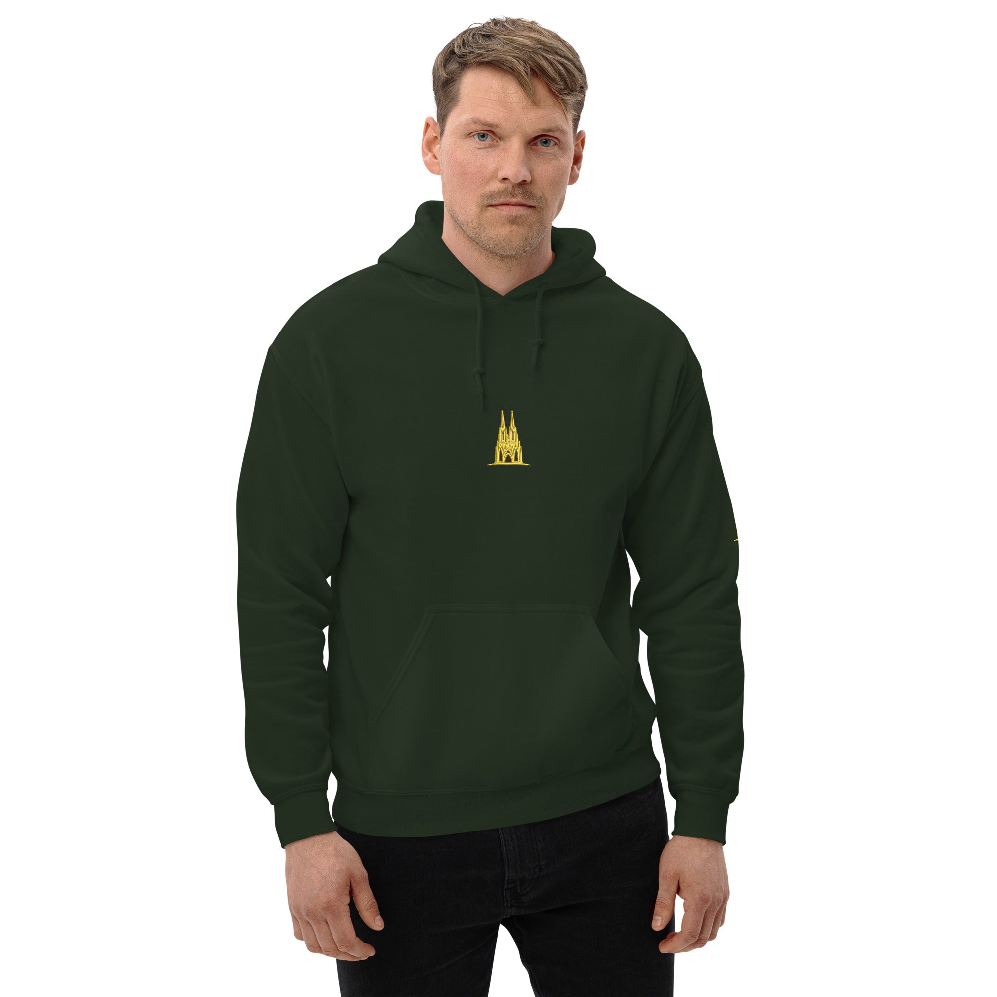 Man wearing a dark green hoodie with a golden köln logo on a white background