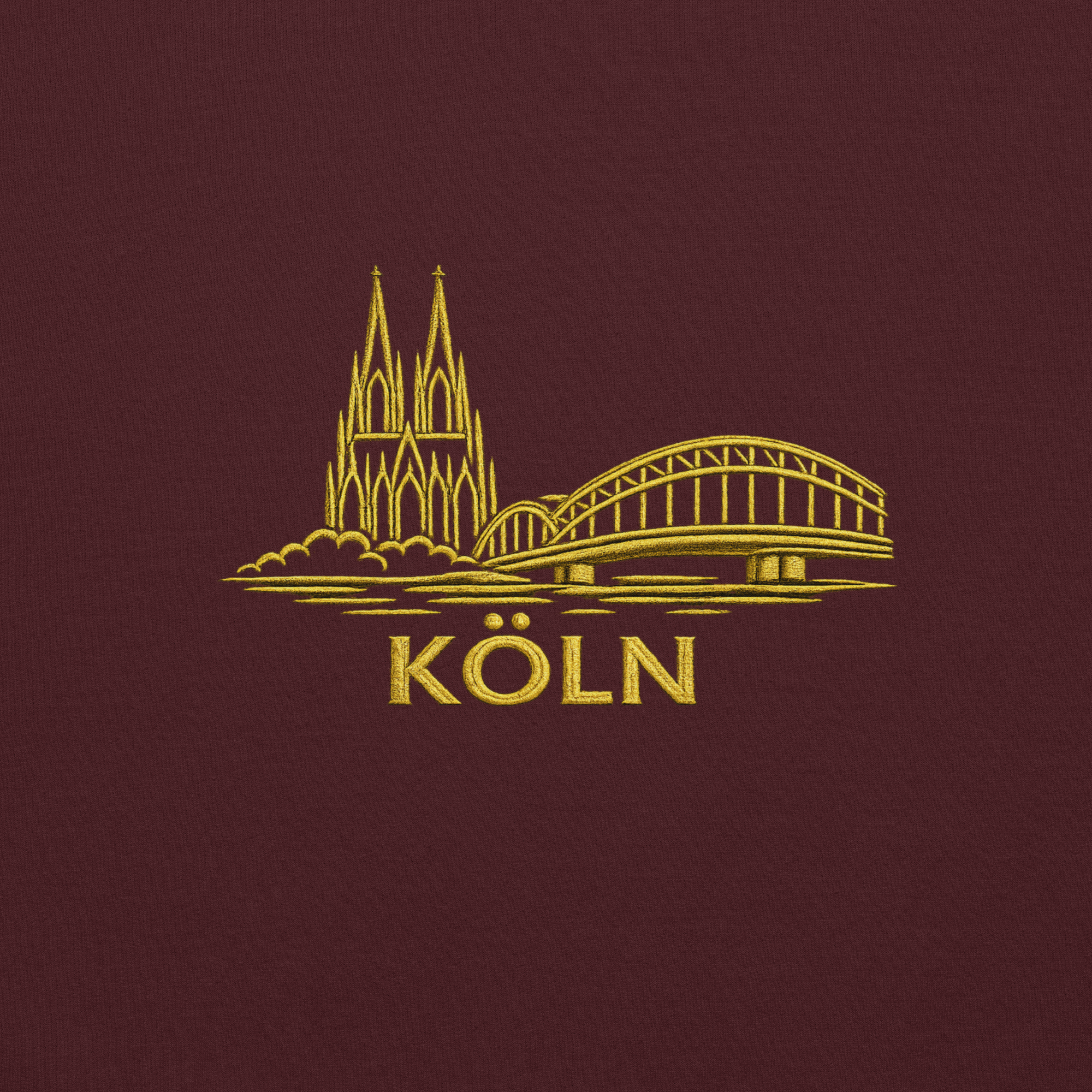 Gold outline of a cathedral and bridge with 'Köln' text on a dark red background