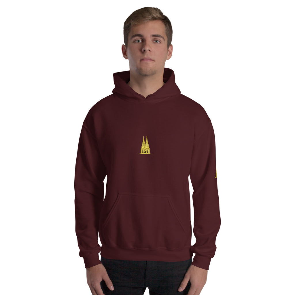 Person wearing Maroon hoodie with a Köln gold logo worn by a person on a white background