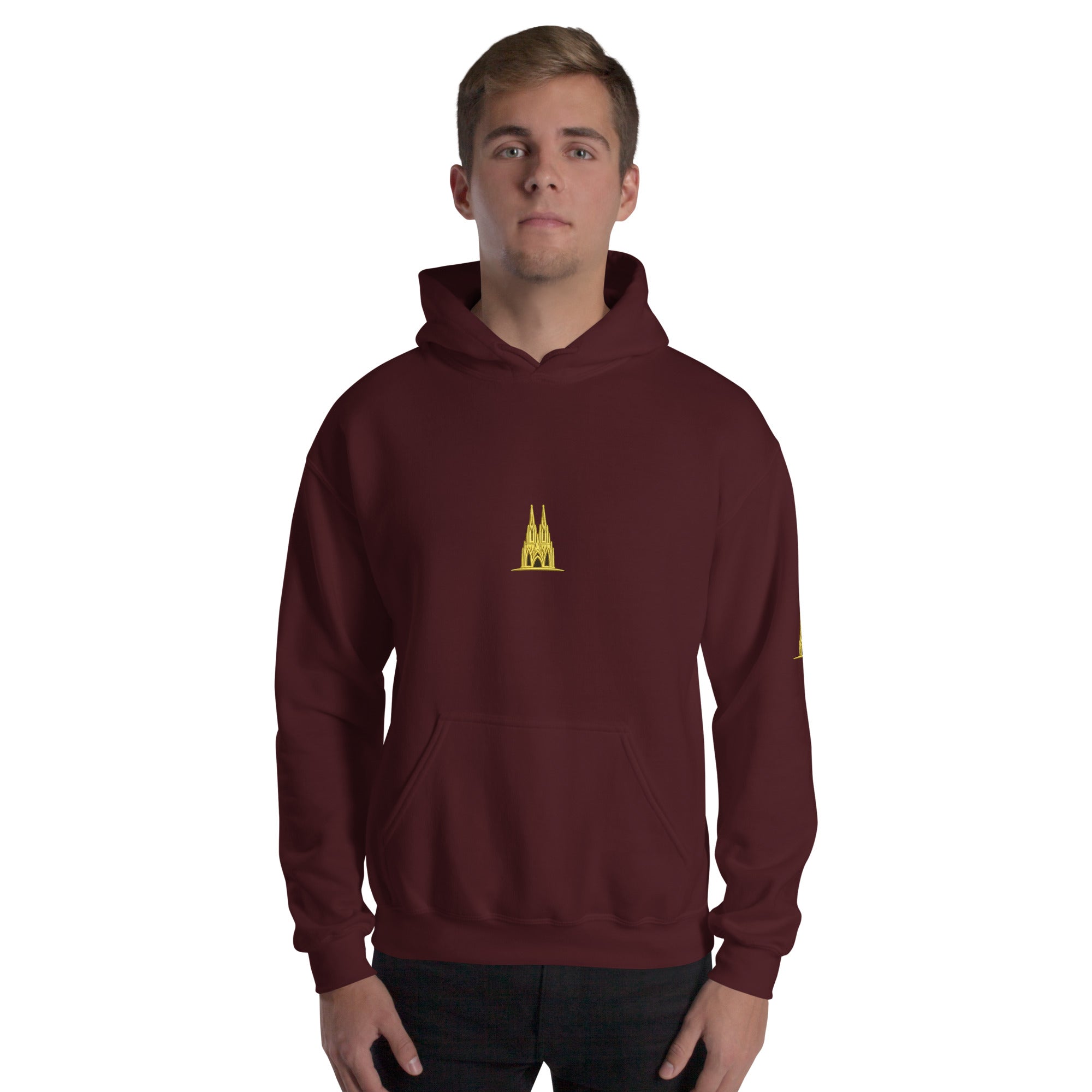 Person wearing Maroon hoodie with a Köln gold logo worn by a person on a white background