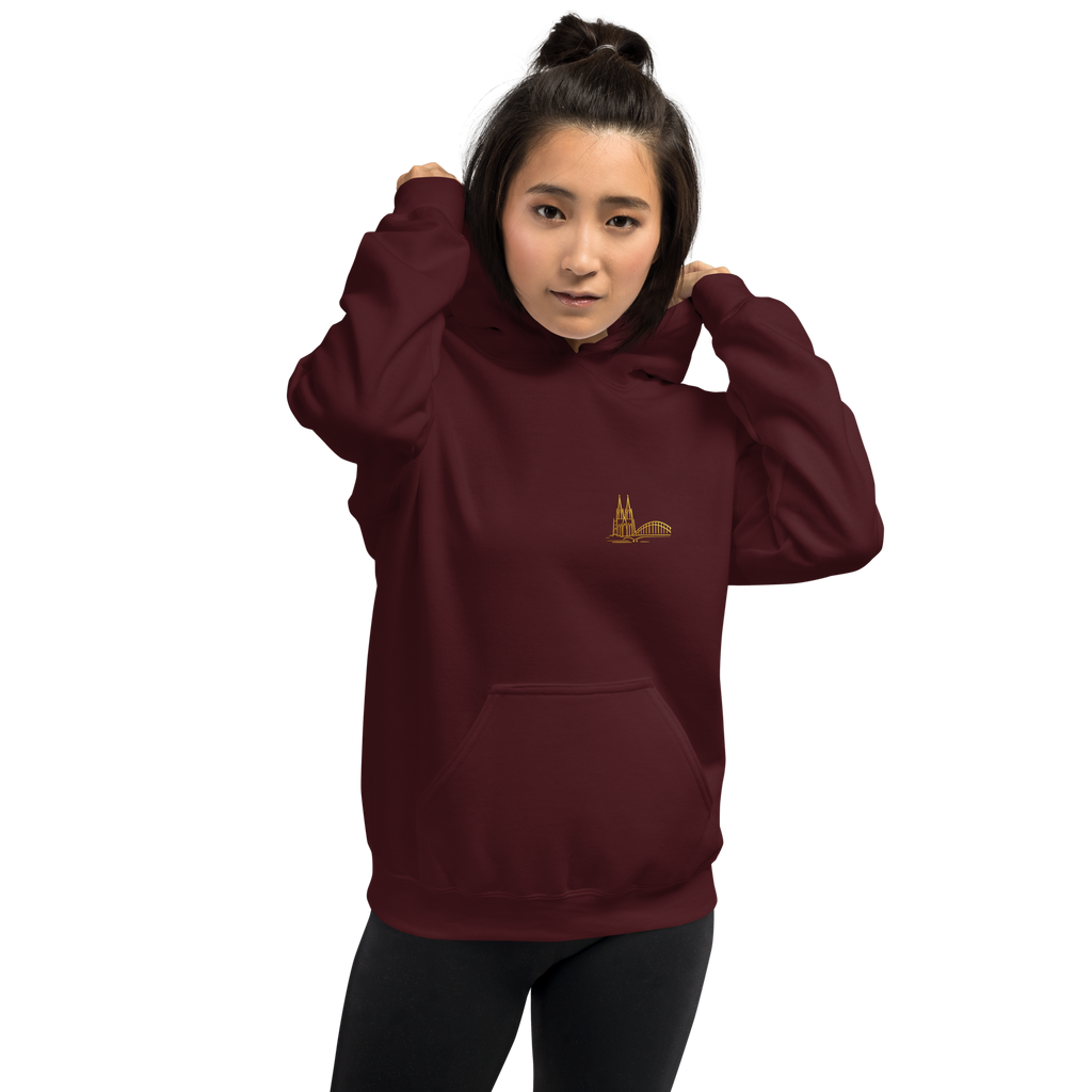 Person wearing a Köln maroon hoodie with a logo on a white background