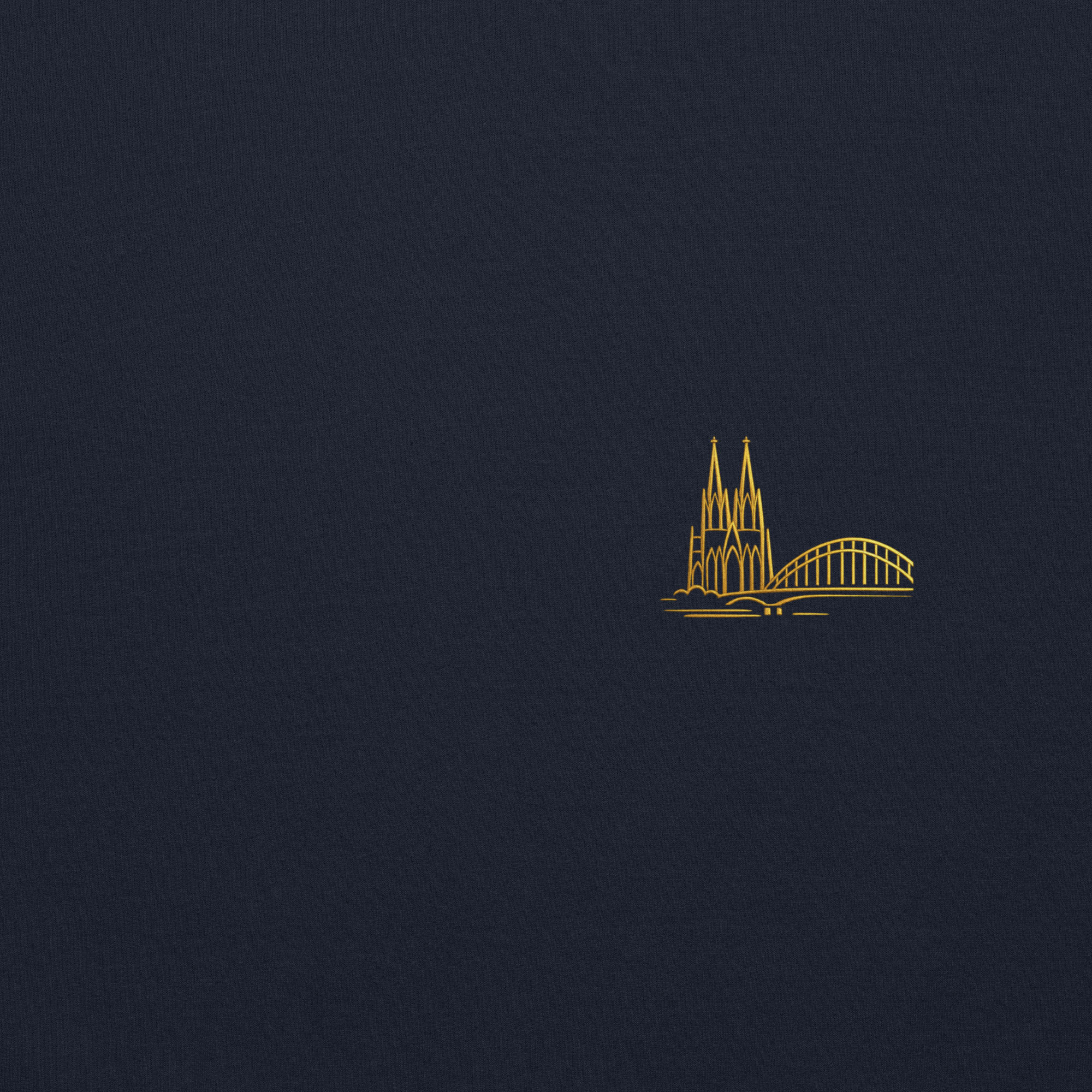 Gold line art of a cathedral and bridge on a dark blue background
