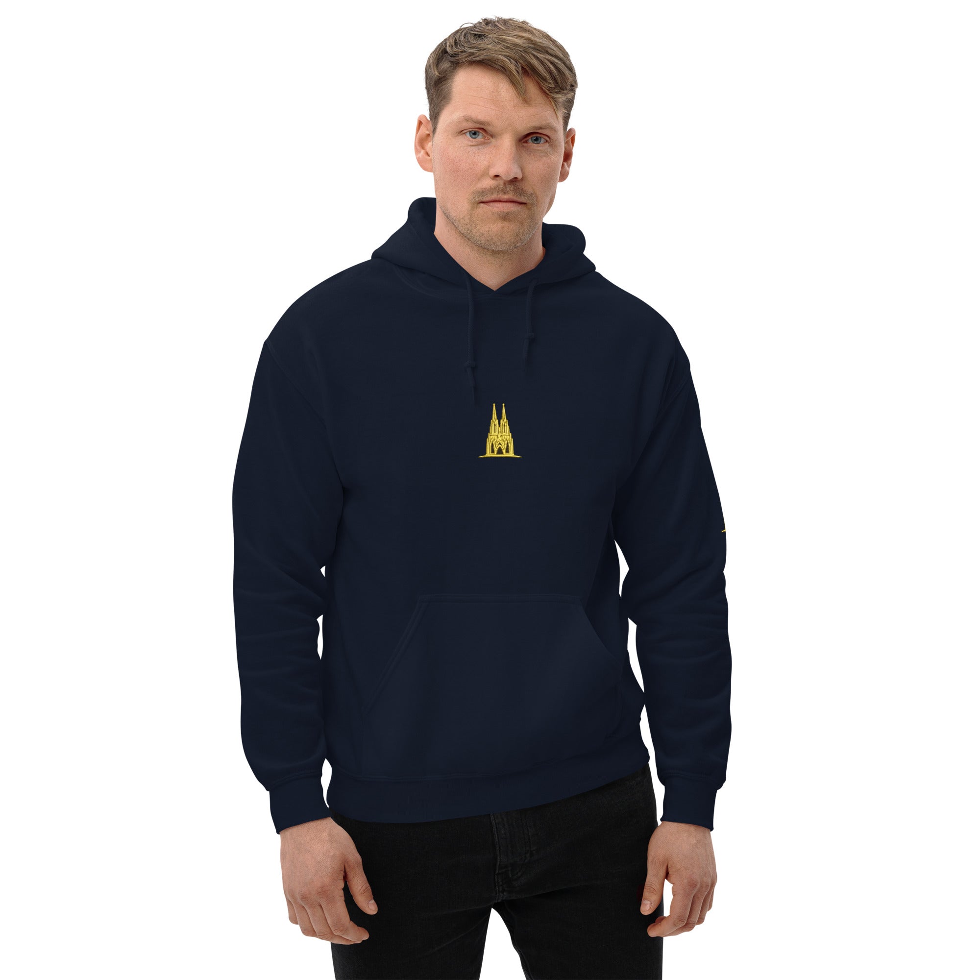 Man wearing a navy blue hoodie with a golden köln logo on a white background