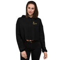 Woman wearing a black hoodie with a logo on a white background