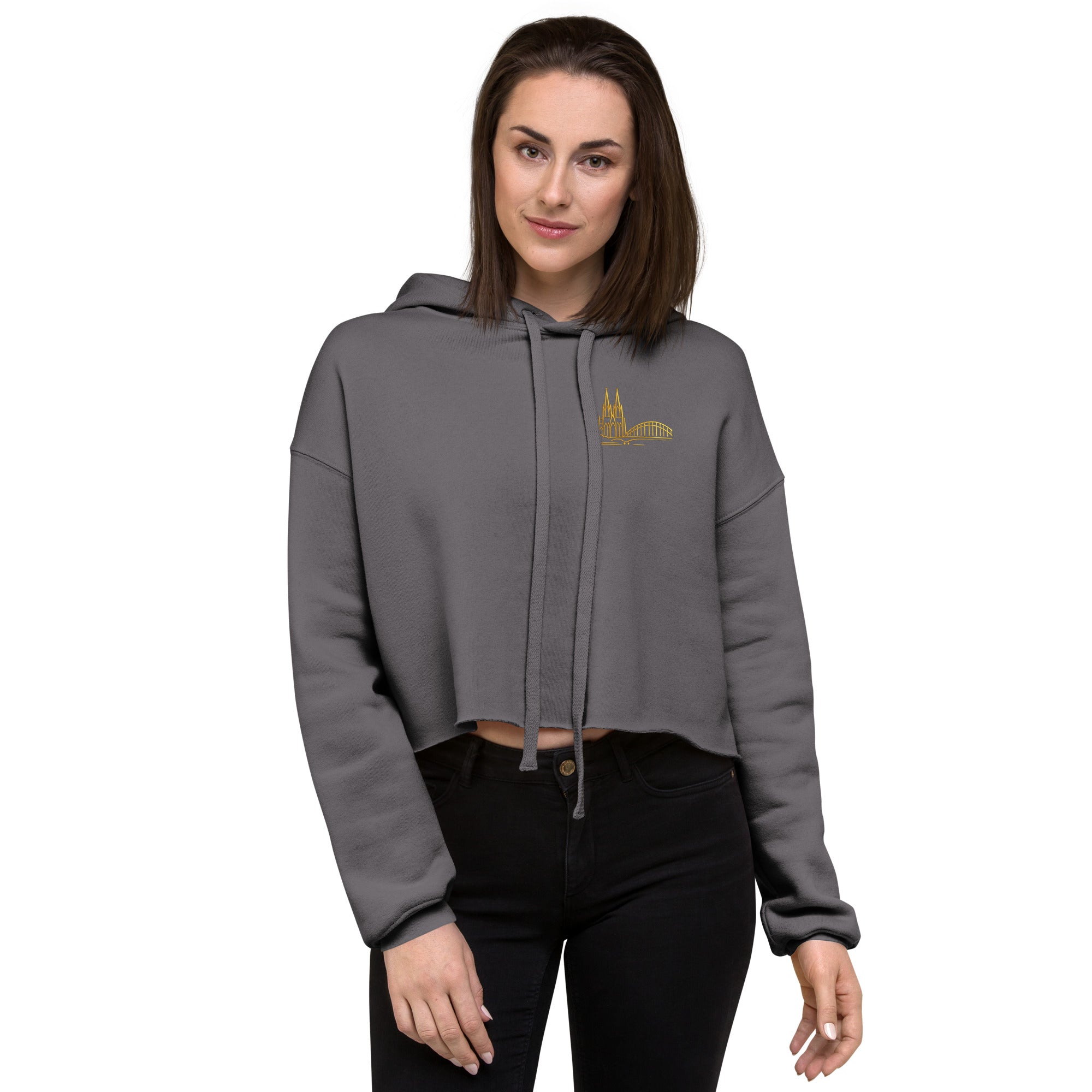 Woman wearing a gray hoodie with a logo on a white background